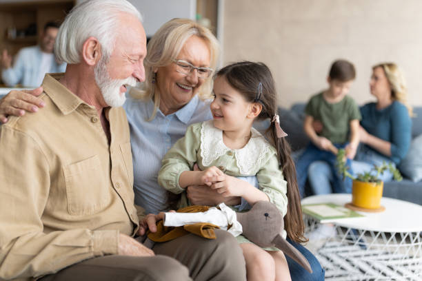 istock Old senior couple with grand daughter 1388183328