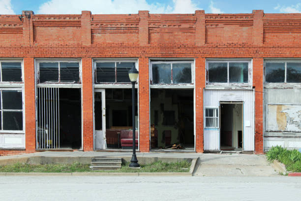 istock small town rural abandoned old vandalized brick building downtown shops wreck damaged storefront 1388183391