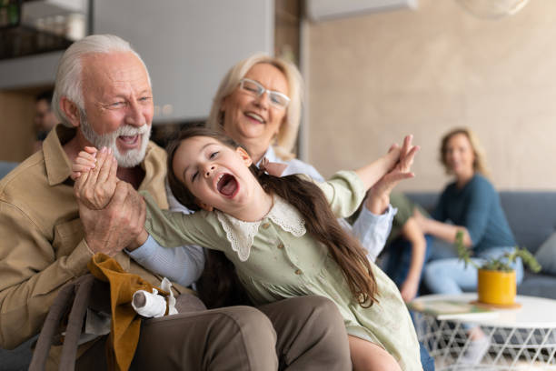 istock Old senior couple with grand daughter 1388184657