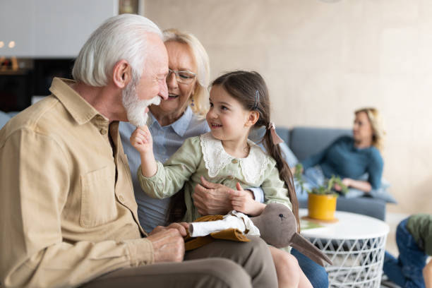 istock Old senior couple with grand daughter 1388184786