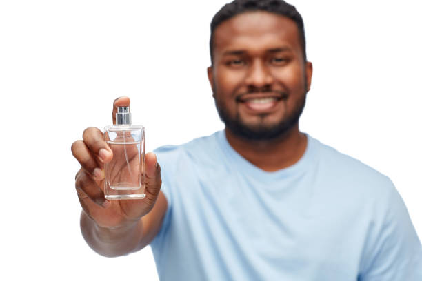 istock happy african american man with perfume 1388184815