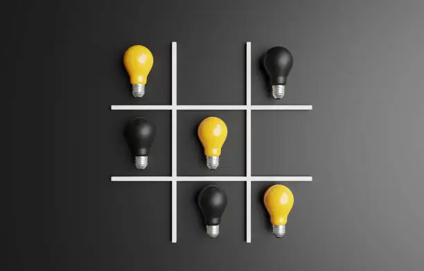 O X or tic tac toe game by use realistic yellow and black lightbulb for creative smart thinking for inspiration and innovation concept by 3d render.