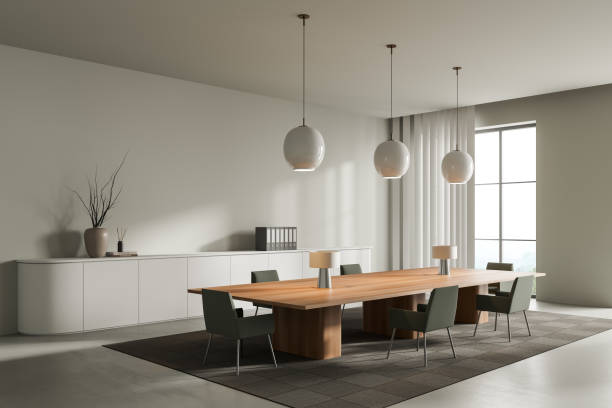 istock Light office room interior with seats, table and shelf with window 1388184876