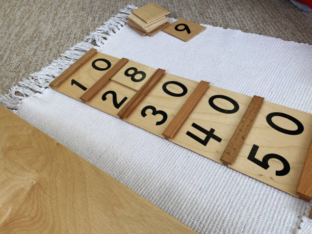 istock Montessori material Segen wood board # 1 with golden material 1388187867