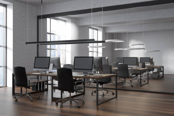 istock Bright office room interior with workplaces and panoramic windows 1388187910