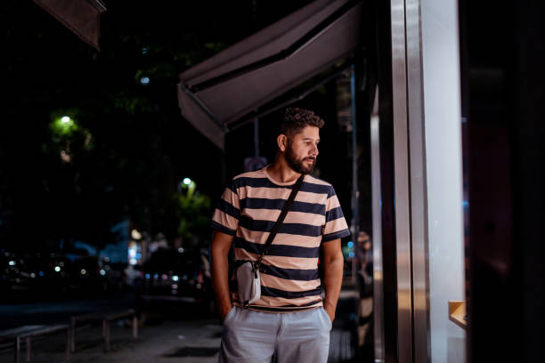 Man looking at shop window At night, casual clothes, city street window shopping at night stock pictures, royalty-free photos & images