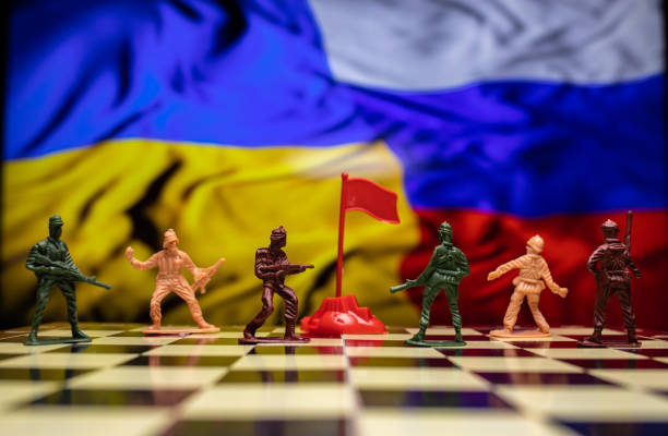 istock War between Russia and Ukraine, conceptual image of war using chess board, warring soldiers and national flags on the background. Ukrainian & Russian crisis, political conflict. Stop the war 2022 1388190572