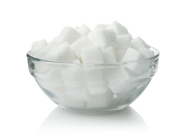 istock Sugar in a glass bowl isolated. 1388190703