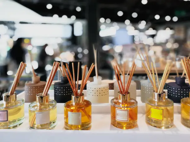 Close up color image depicting scent diffusers on display and for sale in a store. Selective focus.
