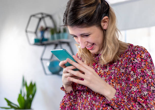 istock A visually impaired young woman  using smart phone. 1388194236