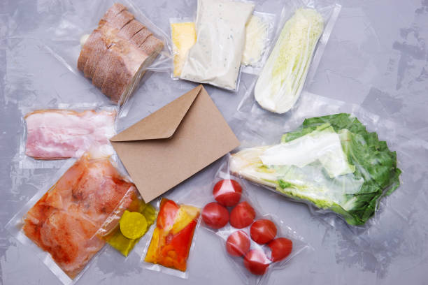 istock Salad dinner set: chicken, lettuce, tomatoes, peking cabbage, cheese, bacon, bread, olive oil sauces and spices. A set for delivering food for dinner on a gray background. I cook at home 1388194411
