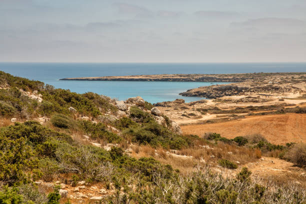 Seascape Cape Greco peninsula park, Cyprus. Seascape Cape Greco peninsula park, Cyprus. It is mountainous peninsula with a national park, rock paths, a turquoise lagoon and a natural stone bridge. greco stock pictures, royalty-free photos & images