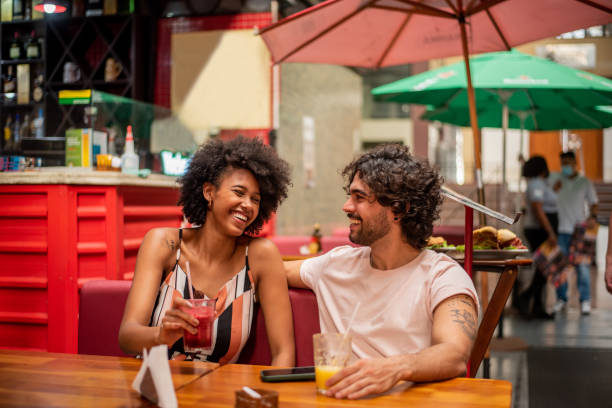 Couple drinking juice at restaurant Municipal market, Sao Paulo, Brazil juice bar stock pictures, royalty-free photos & images