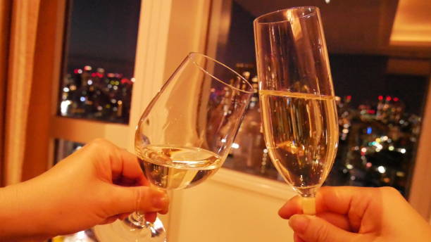 istock Cheers and have fun in front of night view 1388201578