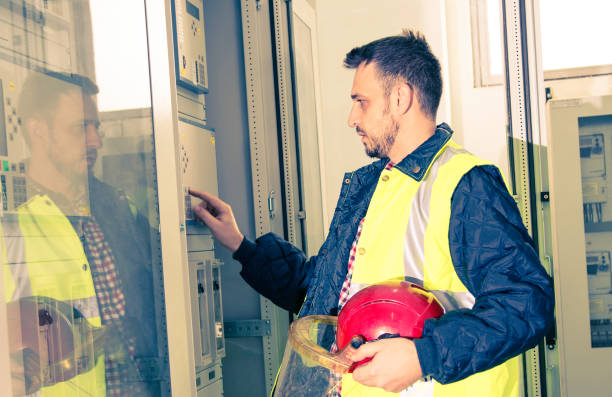 istock Electrician is testing equipment in high voltage power station. 1388202670