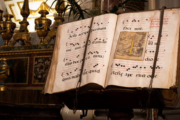Gregorian sings book Palermo, Italy - June 18, 2021. An antique book of Gregorian sings, exposed in the Palermo Cathedral palermo cathedral photos stock pictures, royalty-free photos & images