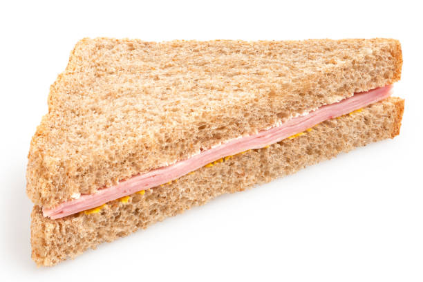 istock Ham and mustard wholewheat triangle sandwich. 1388206027