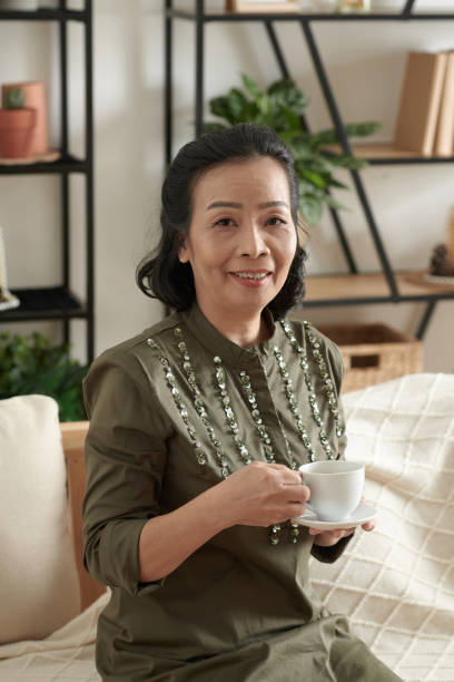 istock Senior Woman Drinking Tea 1388206923