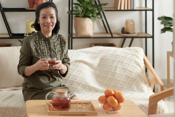 istock Senior Woman Drinking Tea at Home 1388206925