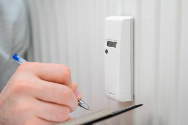 istock Close up man shows on the thermo regulator on the battery. 1388209801