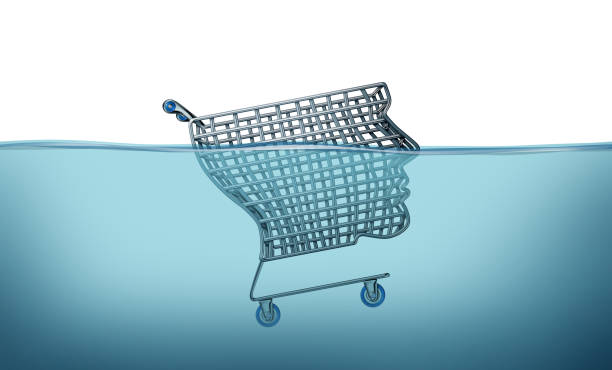 Consumer Crisis Concept Consumer crisis concept and drowning in debt with a shopping cart shaped as a human head sinking in blue water as a symbol of recession or inflation and economic danger with 3D illustration elements. consumer confidence photos stock pictures, royalty-free photos & images