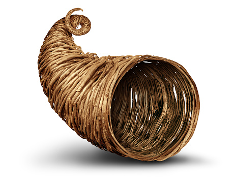 Cornucopia horn object on a white background as an empty rustic traditional hollow wicker or weaved basket.