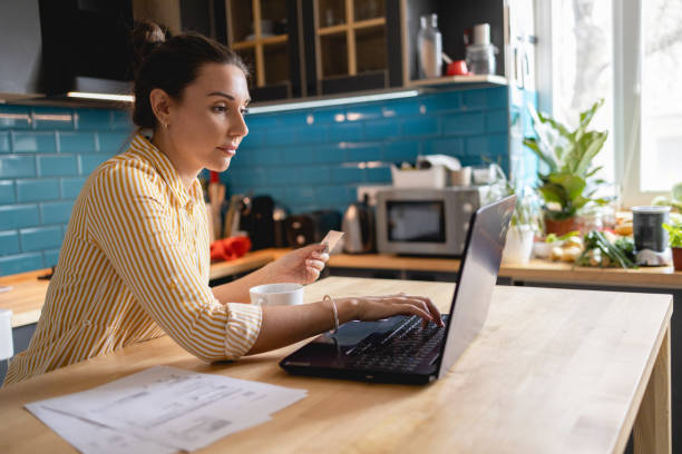 istock Young woman Paying Bills Online 1388210529