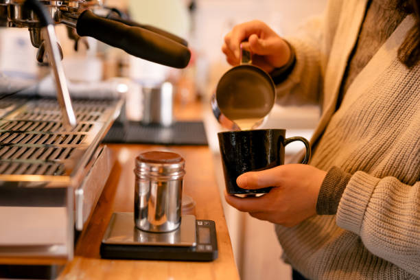 istock Barista hand while making latte ate , routine, part-time job, small business 1388210859