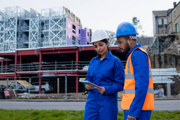 istock Looking at the Blueprints Together 1388212998