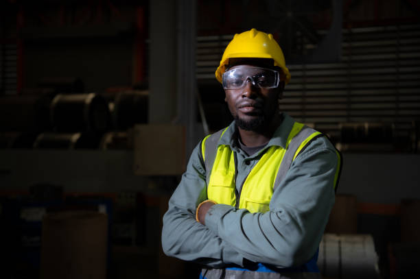 istock Portrait of heavy industrial workers working 1388214923