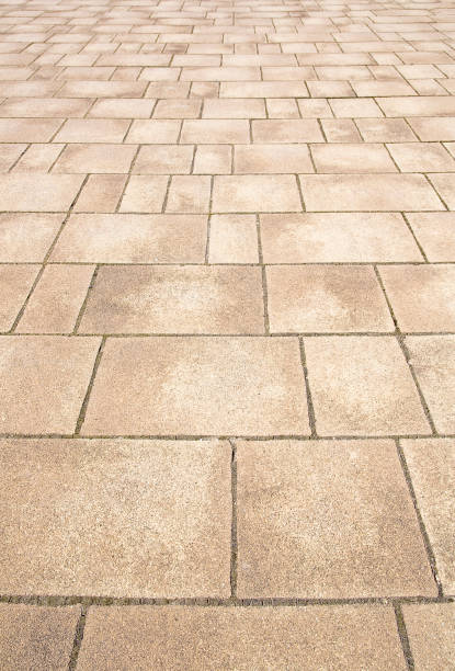istock New paving made with stone blocks of rectangular shape in a pedestrian zone 1388216745