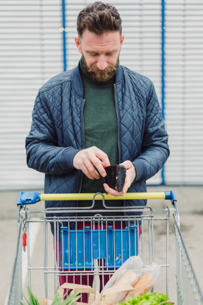 istock Nervous man looking at his empty wallet after shopping 1388217290