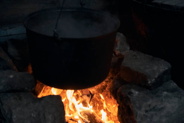 istock a burning hearth in the house and a cooking pot 1388218174