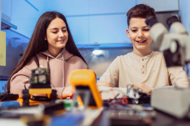 istock Children making a robot at home. Education in robotic at home. 1388218365