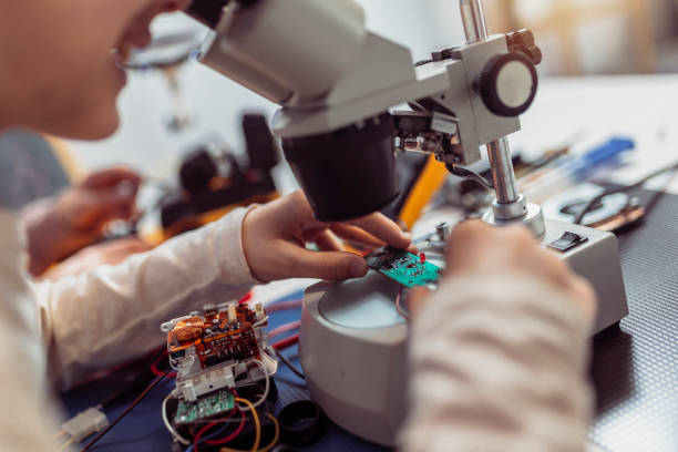 istock Children making a robot at home. Education in robotic at home. 1388218366