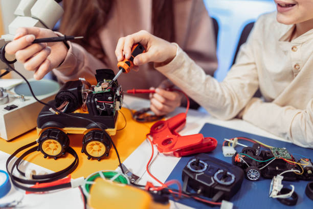 Children making a robot at home. Education in robotic at home. stock photo