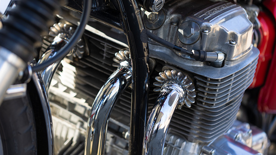 Leiria, Portugal – October 16, 2022: A beautiful chrome Harley Davidson motorcycle parked on display on a road