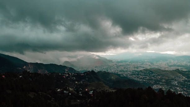 Hill station at dawn, Abbottabad, Pakistan Aerial view of Abbottabad city sunset in a cloudy weather abbottabad stock pictures, royalty-free photos & images