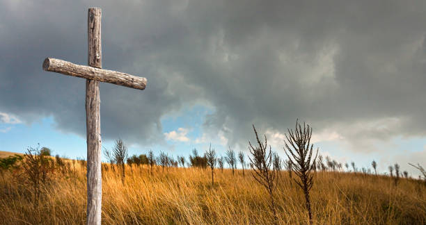 istock a lonely wooden cross 1388223803