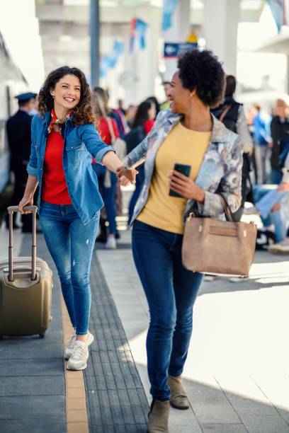 istock Two women at a train station 1388225536
