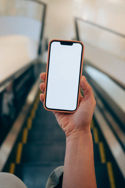 istock An Anonymous Caucasian Individual Checking His Smartphone While Being On Underground Escalator 1388226407