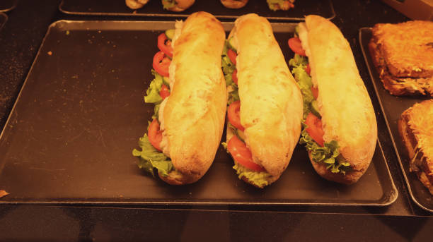 istock sandwich with lettuce, tomatoes prosciutto and cheese 1388226474