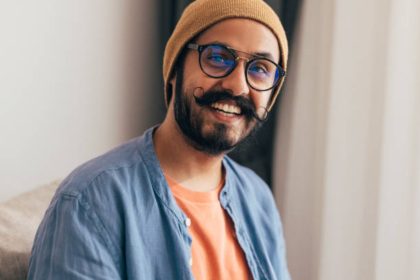 istock A Portrait Of A Happy Casually Dressed Programmer With Moustaches Looking At Camera 1388227888