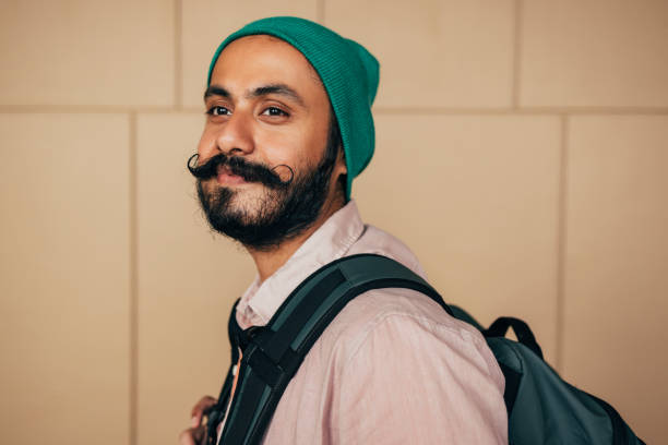 istock A Side View Of A Happy Casually Dressed Man With Moustaches Looking Away 1388227977