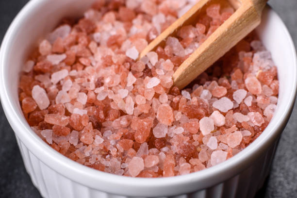istock Pink and white large Himalayan salt in a white saucer 1388228229