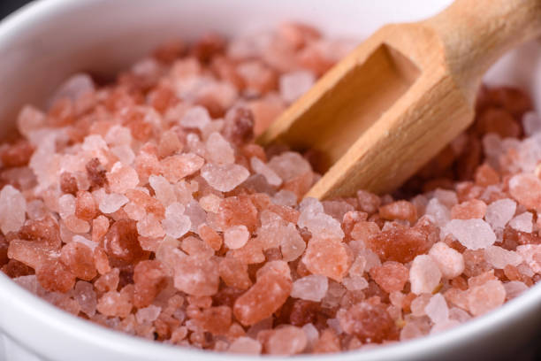 istock Pink and white large Himalayan salt in a white saucer 1388228266