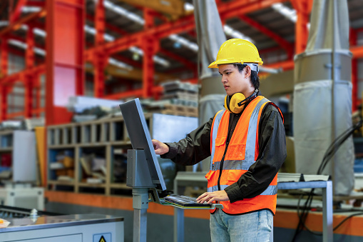 Technication Engineering Technician Worker Is Operating The Machine Inside Factory ...