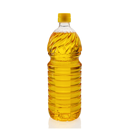 Vegetable oil in plastic bottle, corn oil for frying and cooking, isolated on white, clipping path