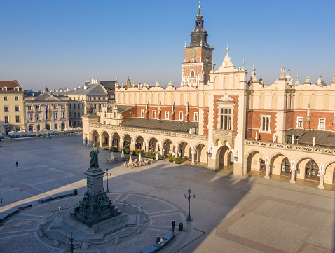 Kraków Cloth Hall (Sukiennice) and  Adam Mickiewicz Monument in main square in Lesser Poland. city's most recognizable icons. It is the central feature of the main market square in the Kraków Old