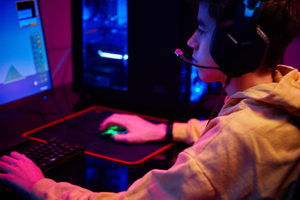 istock Boy plays computer game at home, gaming addiction 1388233890